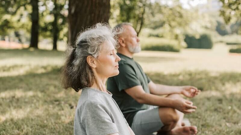 Elderly People Meditating in the Park